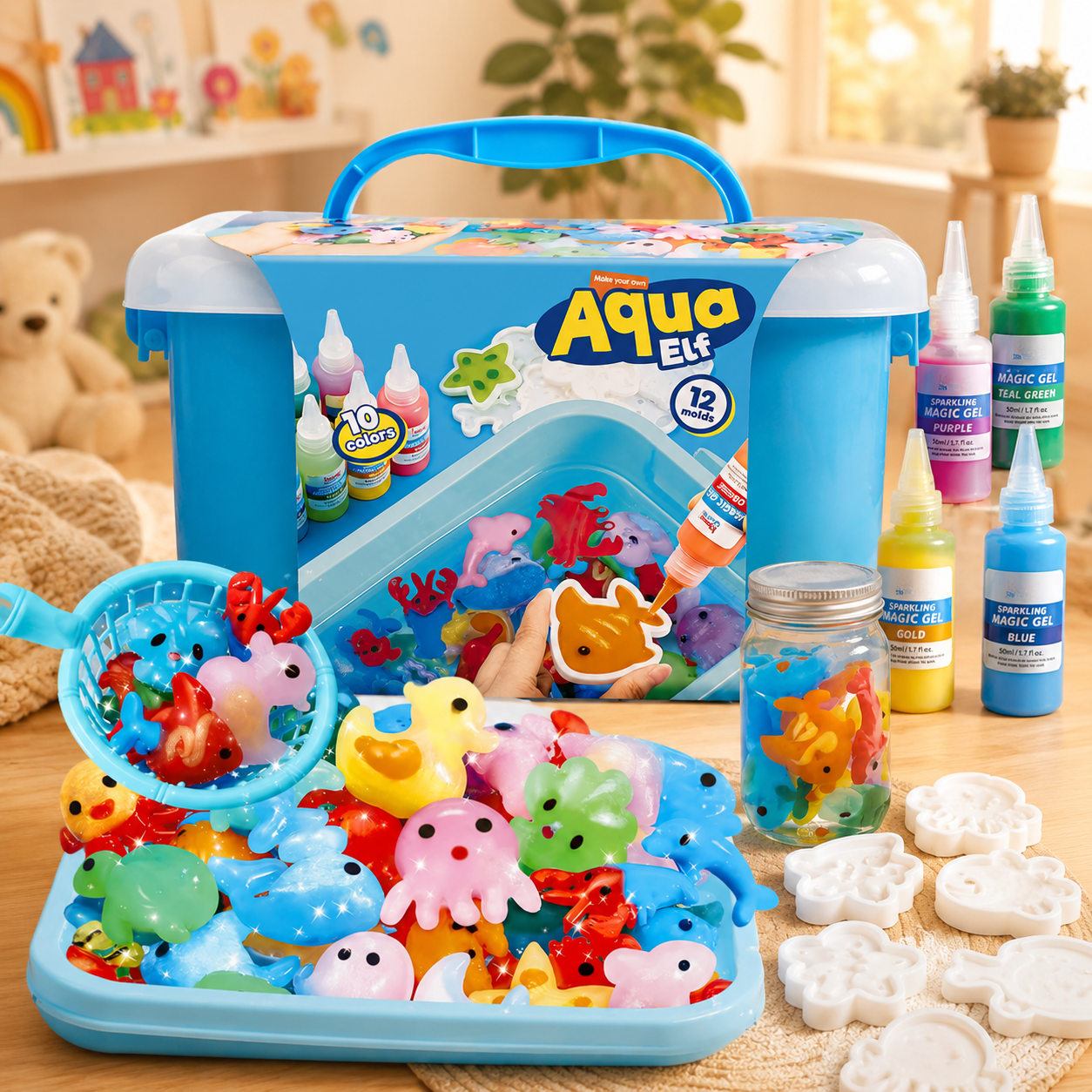 A children's Aqua Elf craft kit displayed on a tabletop with its blue carrying case, assorted colorful plastic fish and sea-creature pieces, white mold shapes, paint bottles, and a glass jar of colorful liquid. The scene is styled in a warm indoor room with toys and plants in the background.